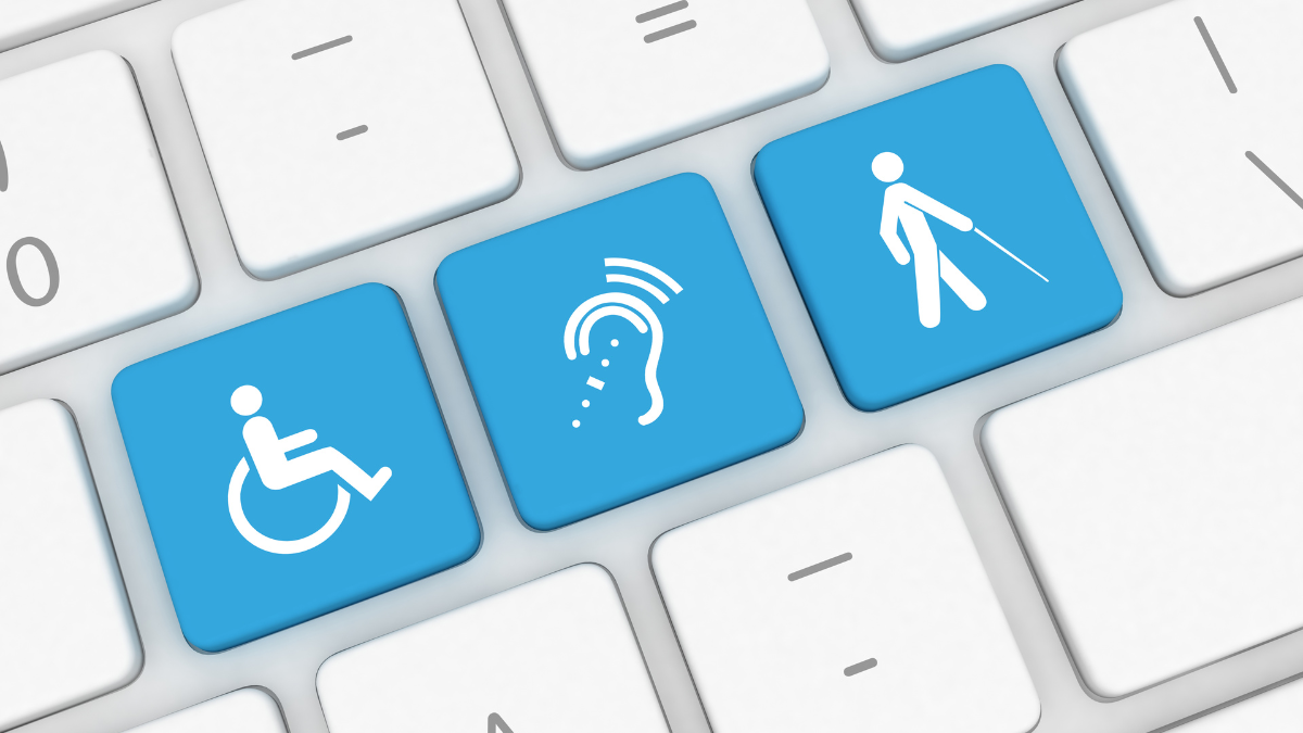 Keyboard with three blue keys showing wheelchair, hearing and vision impairment accessibility symbols.